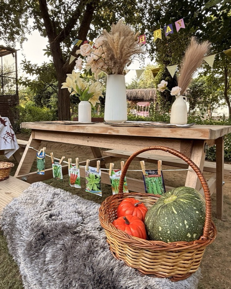 A harvest basket and seed-packet garland on the party table