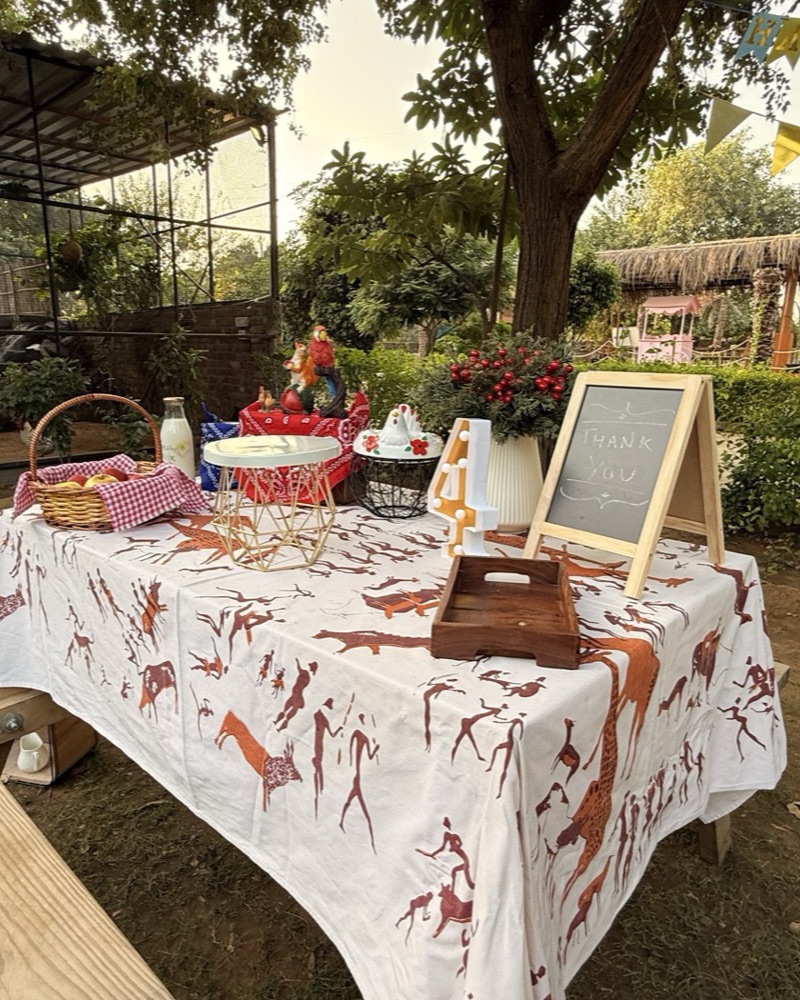 A styled celebration table with vintage farm props